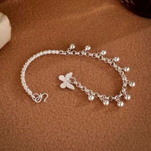 Elegant Silver Bracelet with Floral Charm